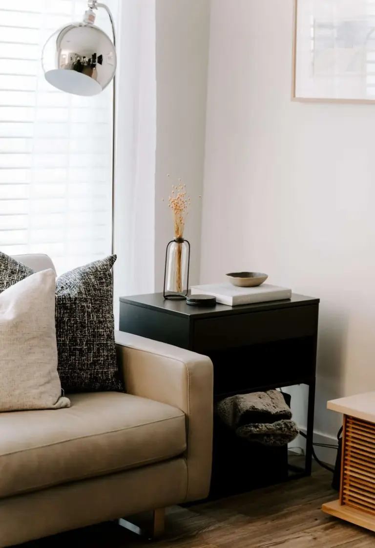 A clean, sparsely furnished living room corner in an empty property